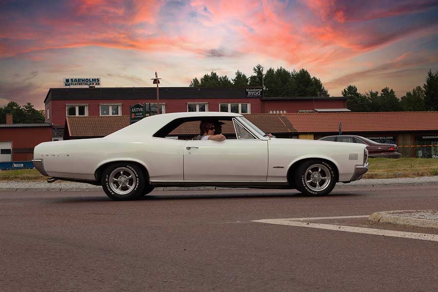 Vintage car cursing in the sunset