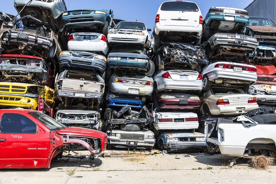 Stacked cars in junk yard